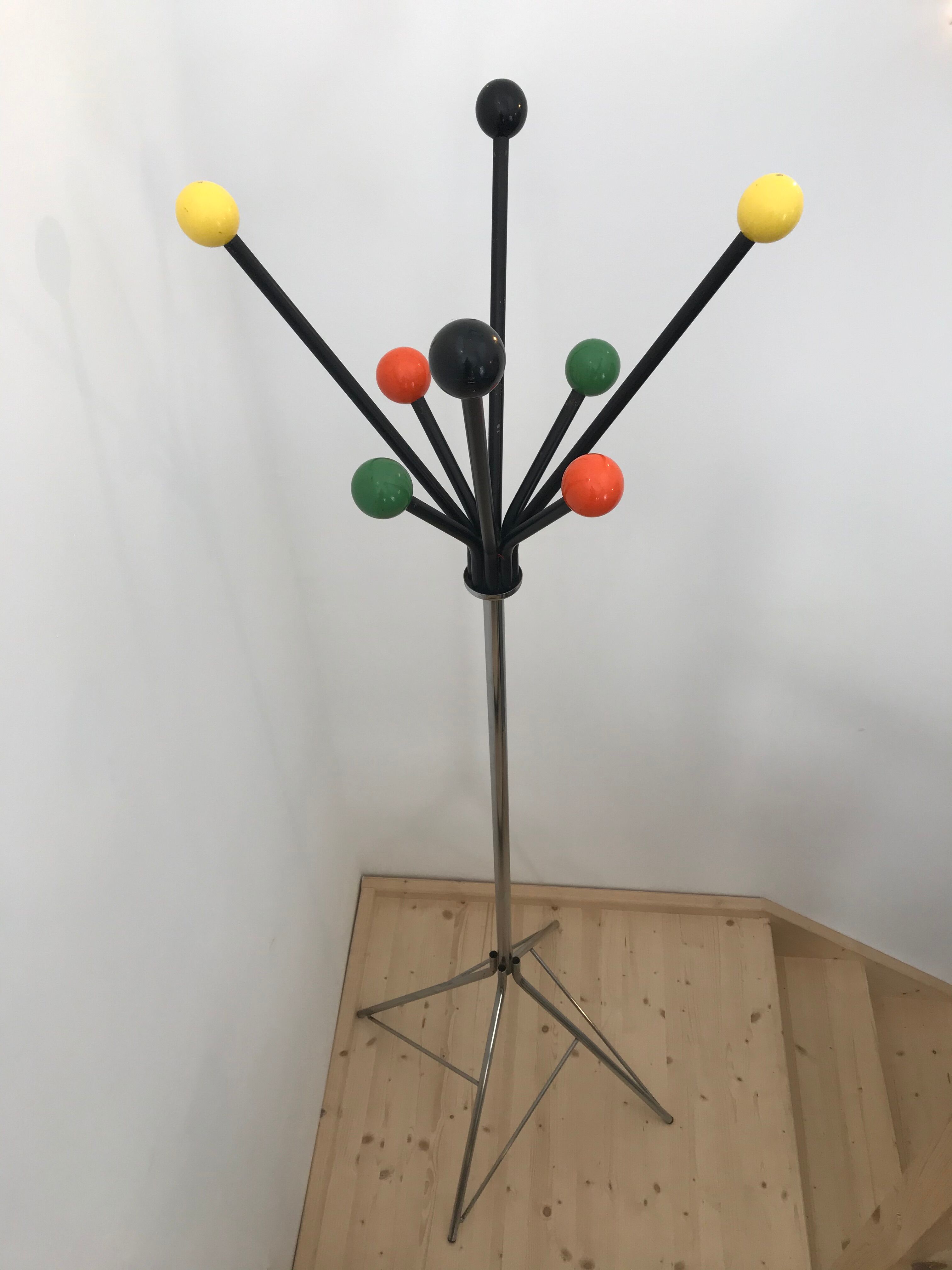 Wearing chrome parrot coat, black and multicolored balls