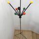 Wearing chrome parrot coat, black and multicolored balls