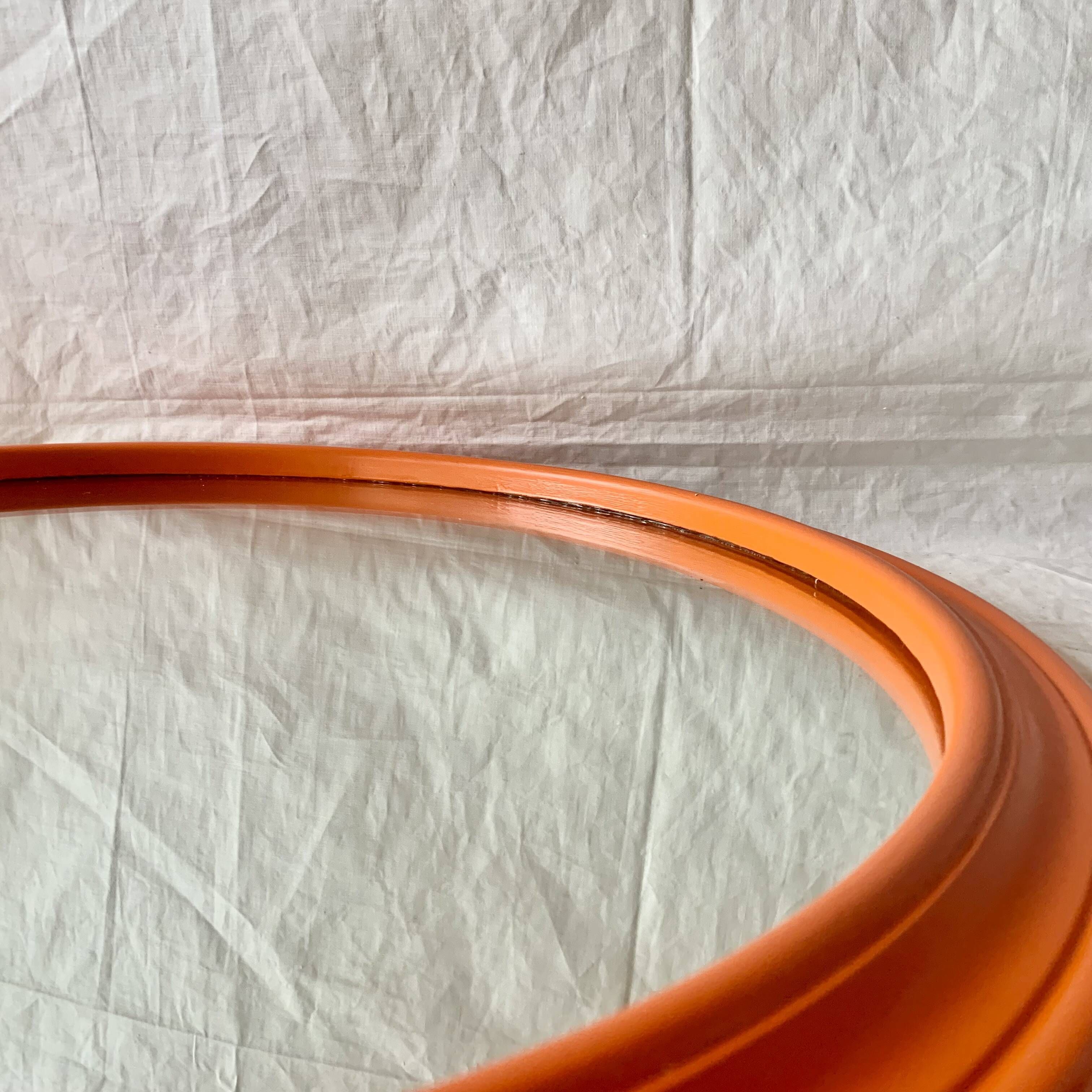 Vintage round wall mirror in orange painted wood - diameter: 48 cm