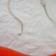 Orange glass suspension