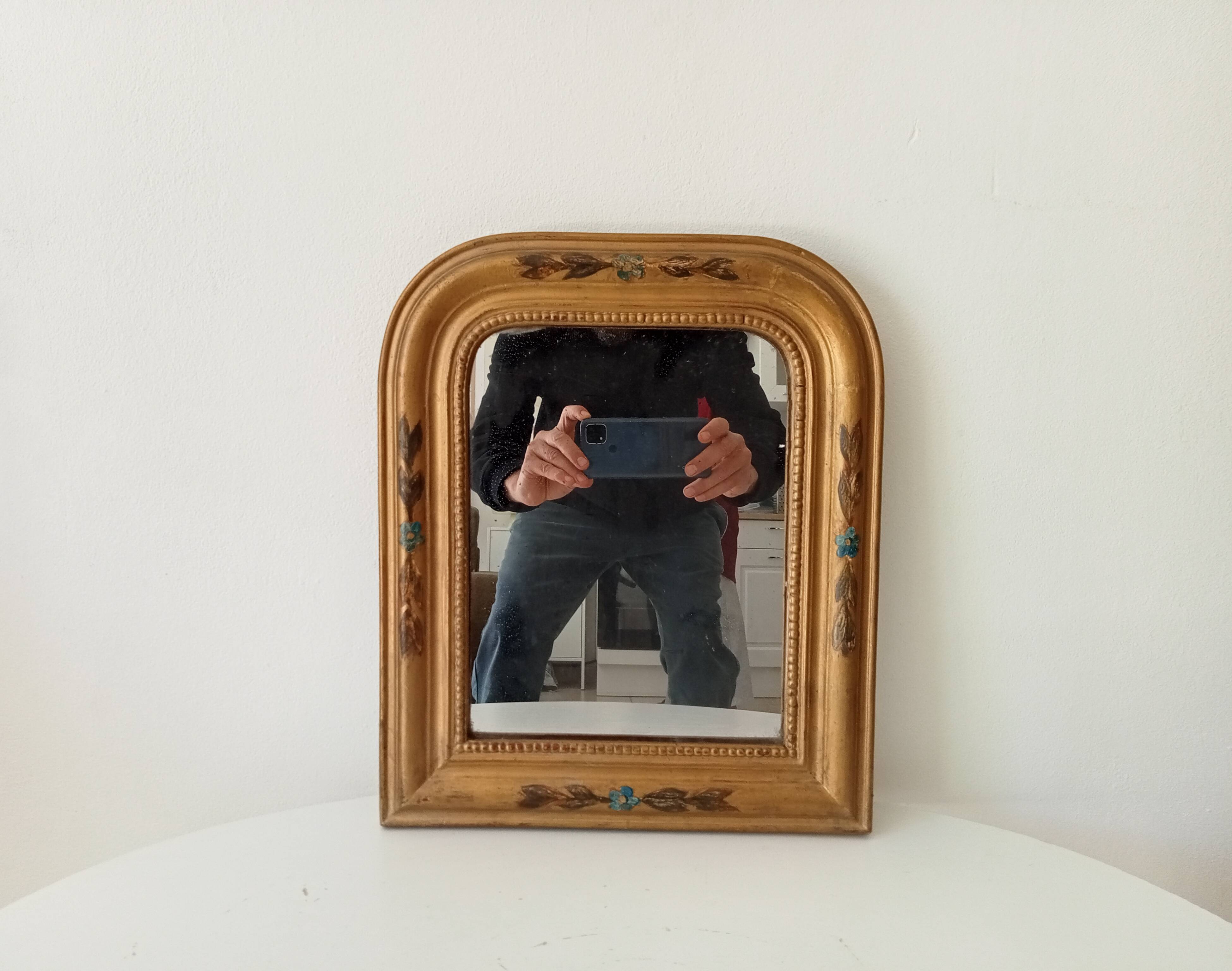 Antique Louis Philippe mirror in gilded solid wood.