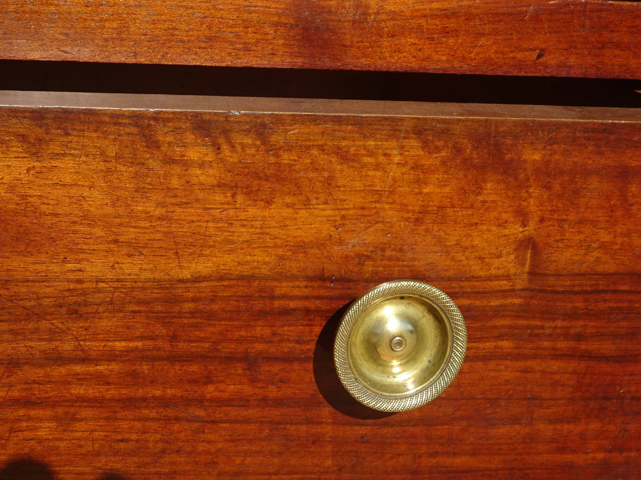 Crossed walnut chest of drawers