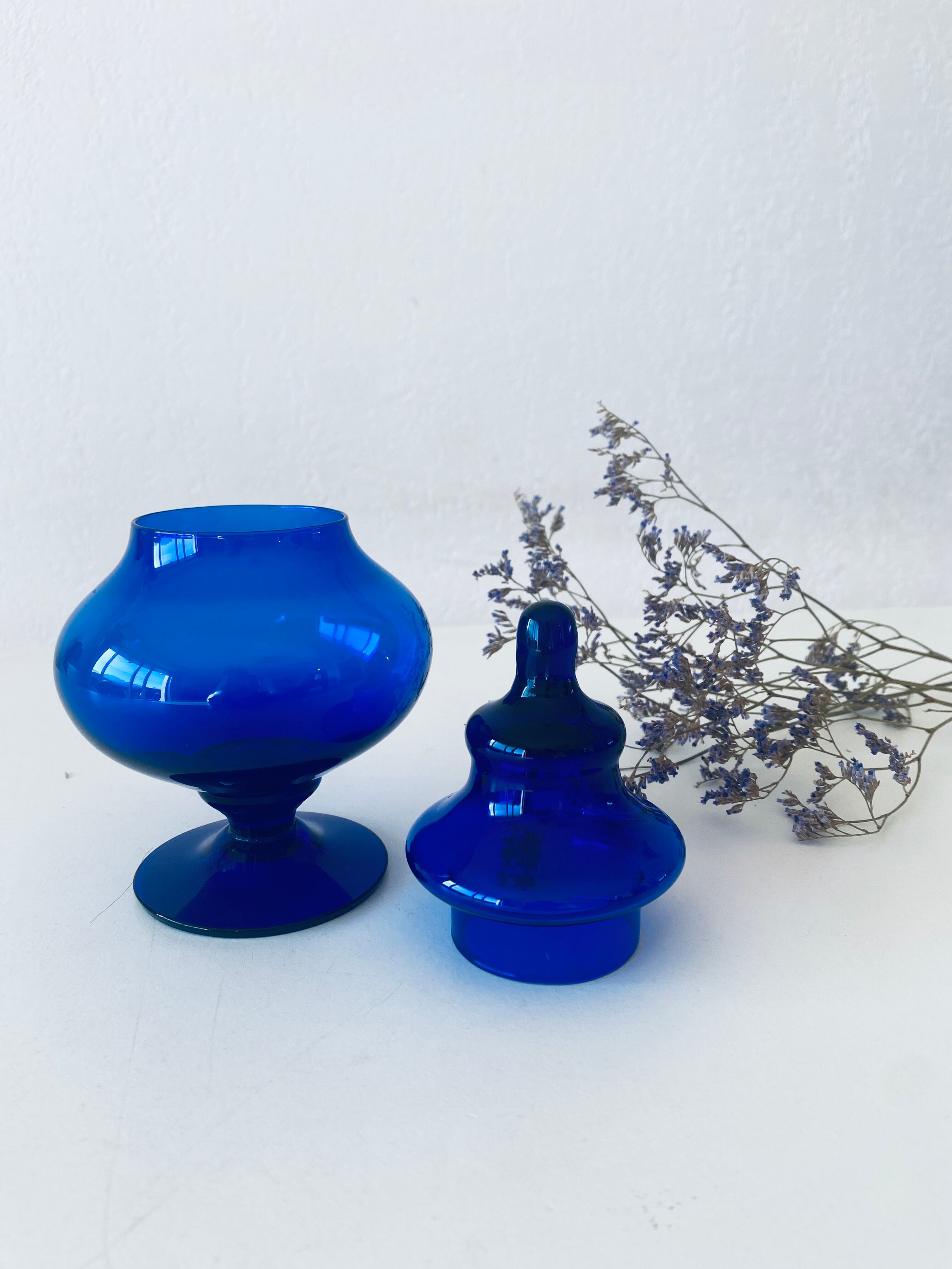 Blue glass apothecary shaped bottle