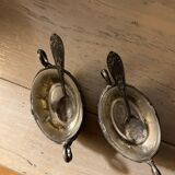 Salt and pepper shakers with silver spoons