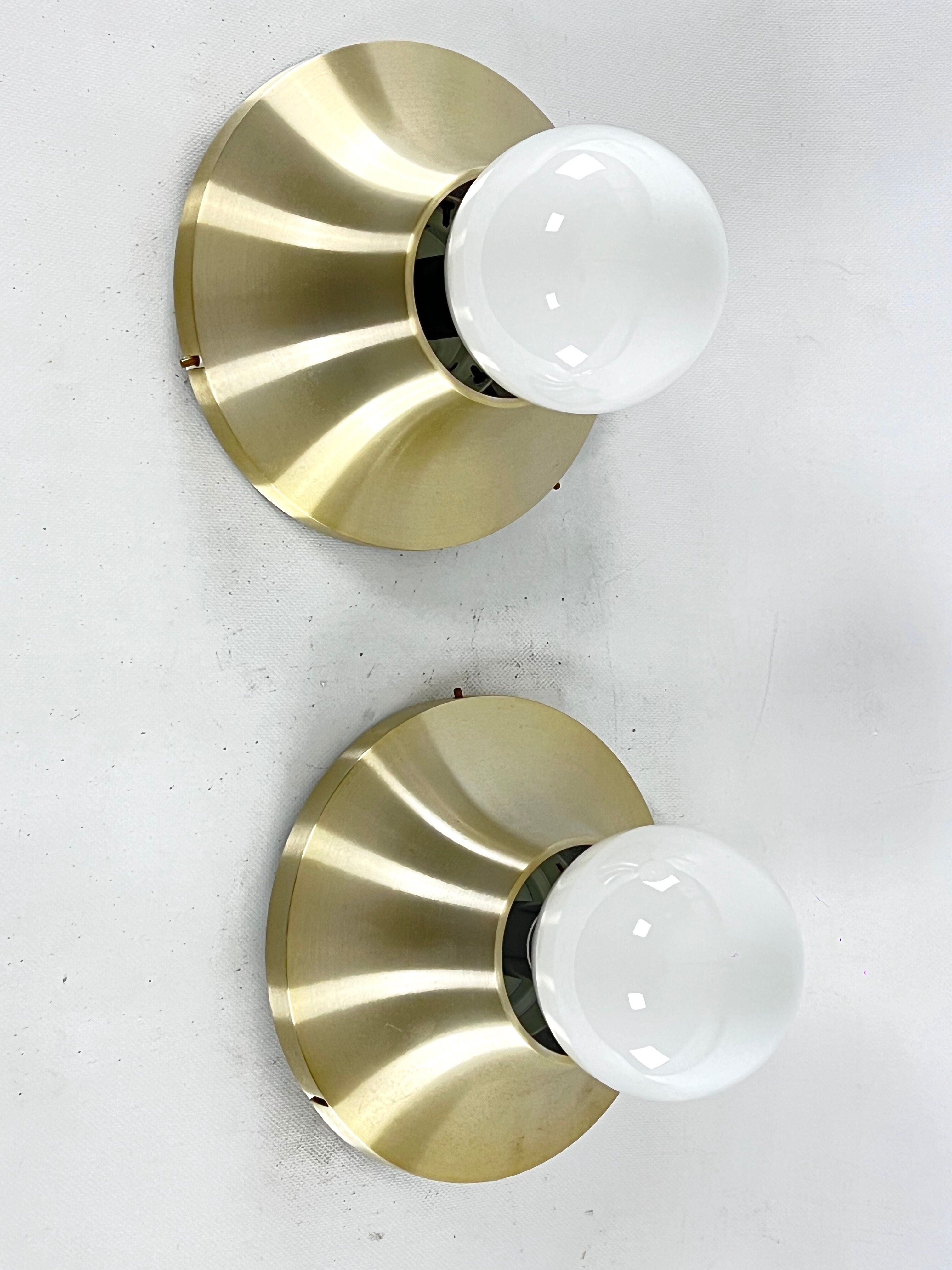 Stilux Milano, vintage round gilded aluminum wall lamps from 60s. Set of two