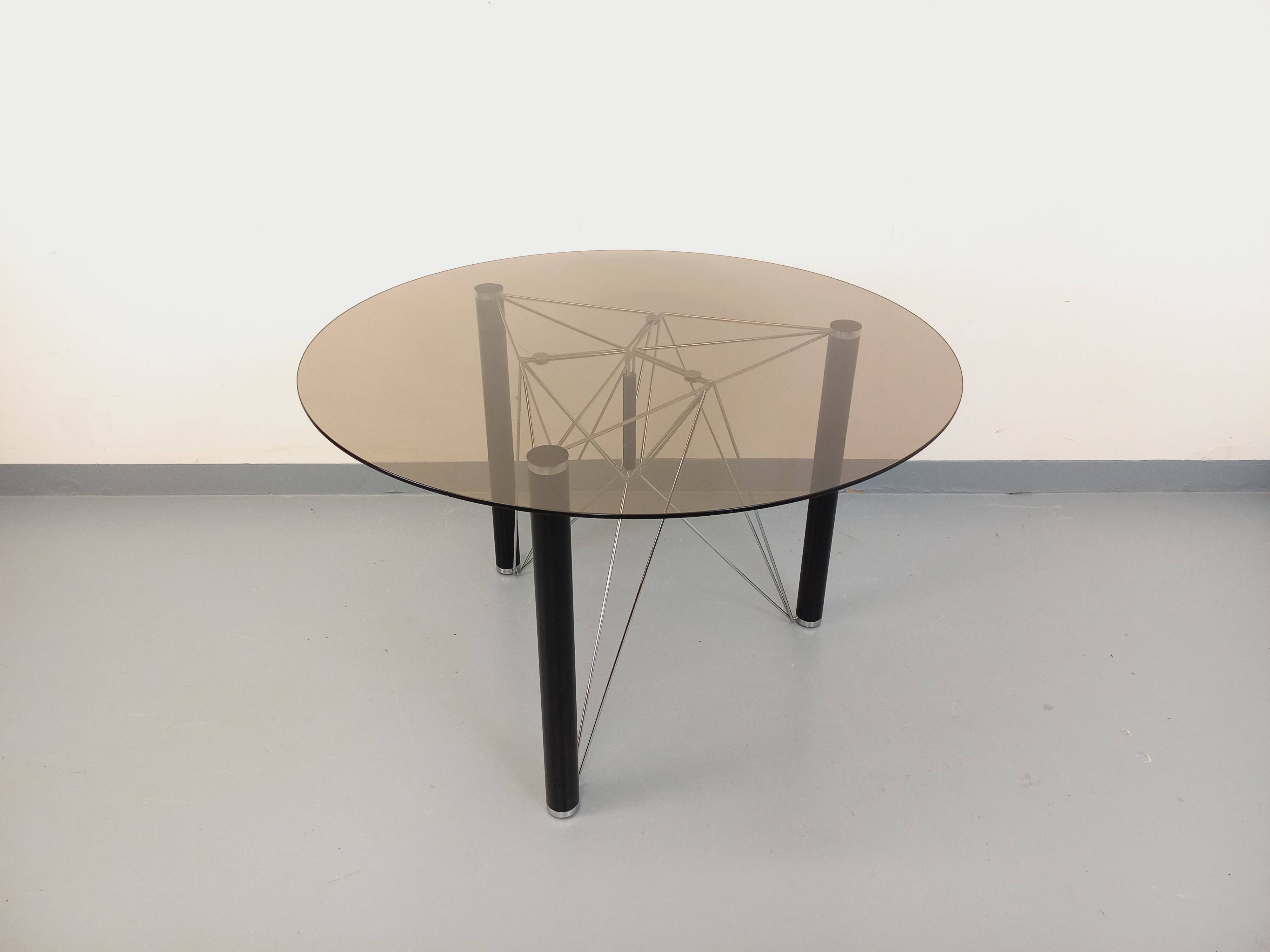 Vintage round dining table in smoked glass, black metal and chrome metal.