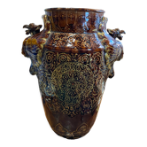 Important Longchamp Griffon vase in golden ceramic