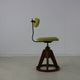 Fifties design working chair with stabilizing wooden ring base