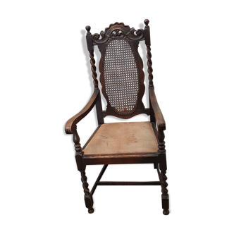 Solid oak and leather armchair