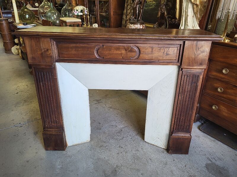 Facade of antique wooden fireplace