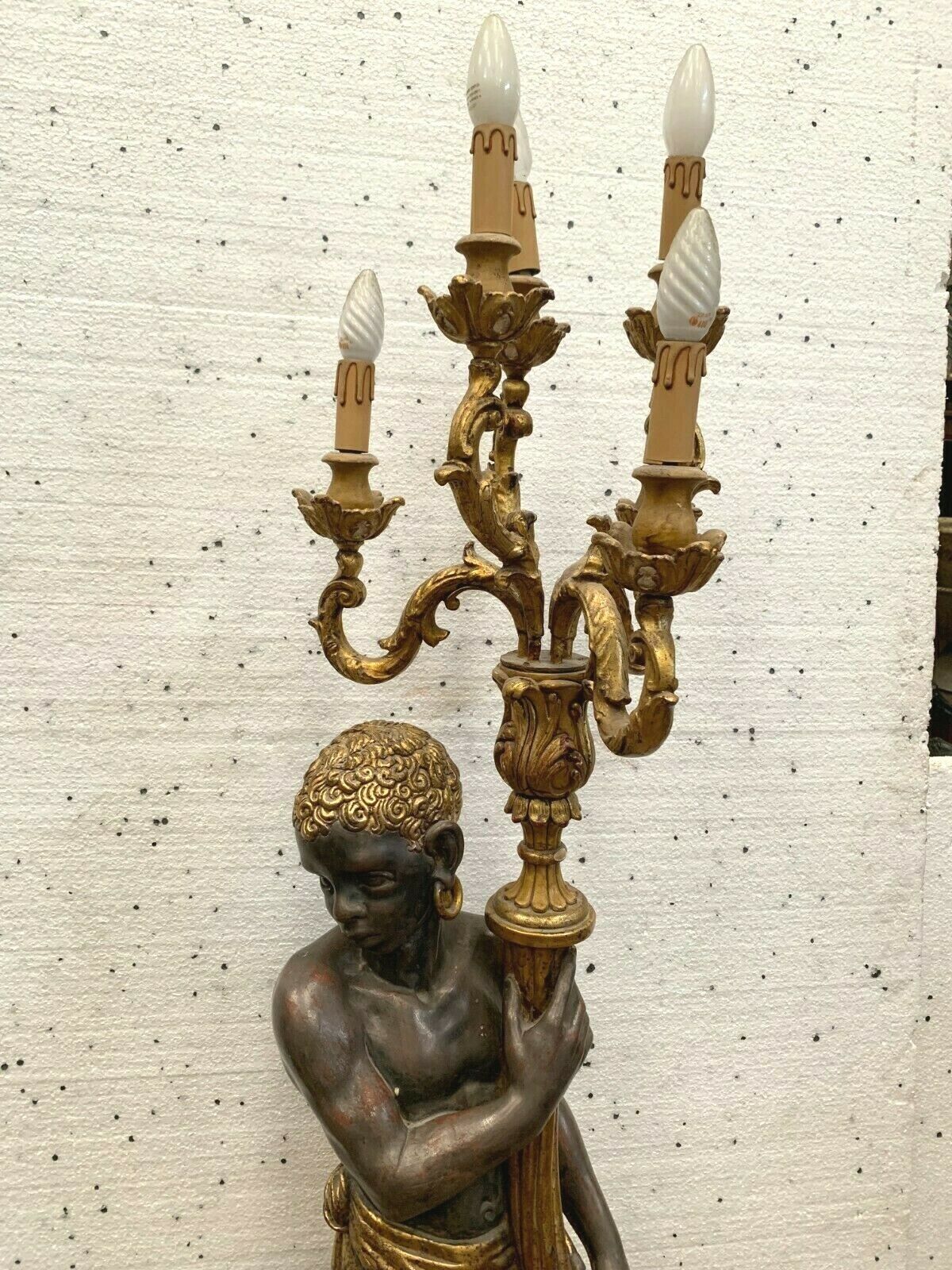 Torchère decoration of a nubian in wood and gilded stucco XX century