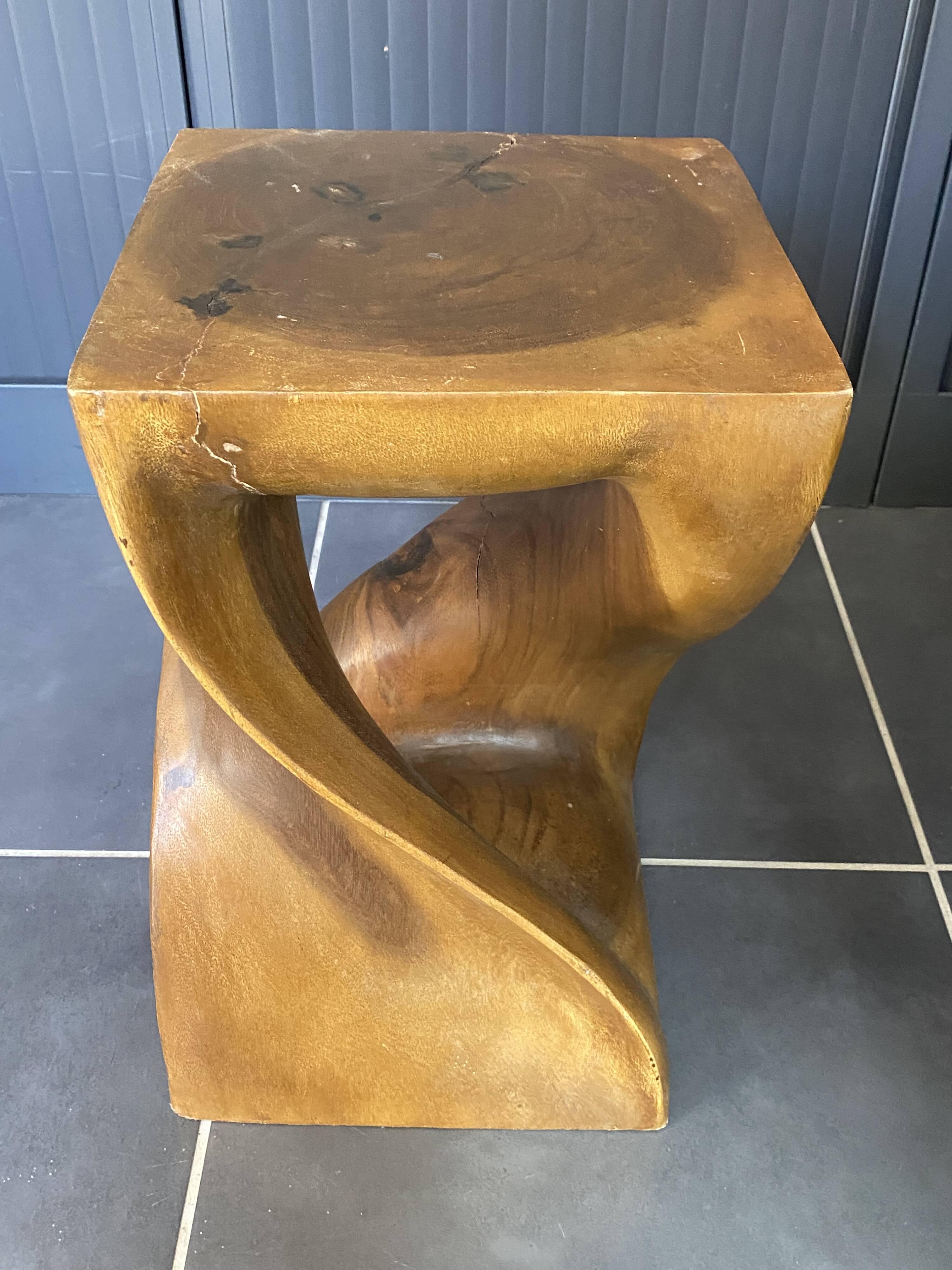 Stool n2 in solid raw walnut wood carved from the mass 1970