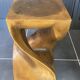 Stool n2 in solid raw walnut wood carved from the mass 1970