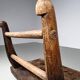 Rustic Wabi-Sabi style accent chair in dark curved hardwood, 1900s.