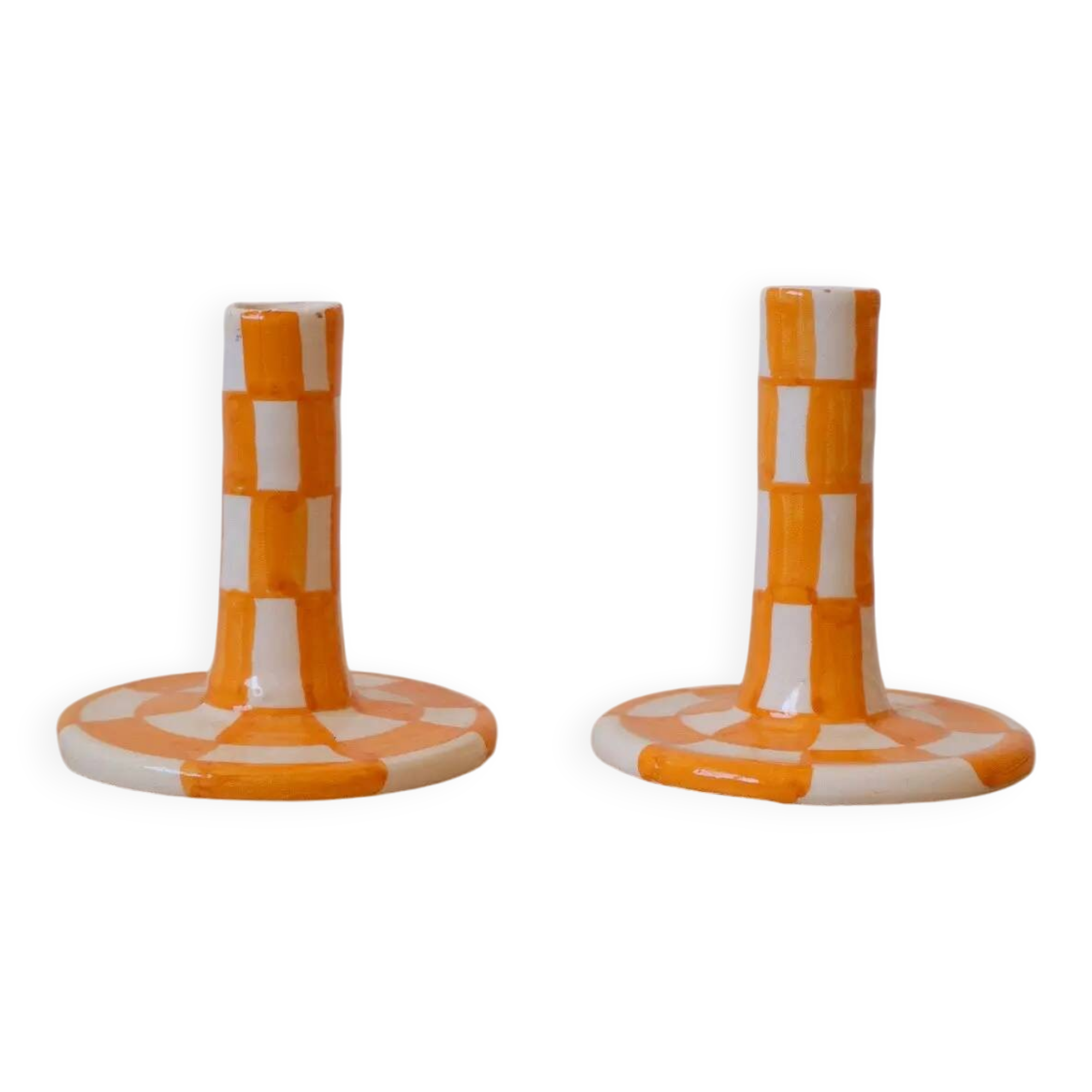 Pair of yellow and white checkered ceramic candlesticks