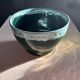 Green cache pot with a foam trim.