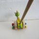 Push toy, wooden dinosaur. Brand: Bino