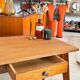Old wooden desk or side table with compass legs
