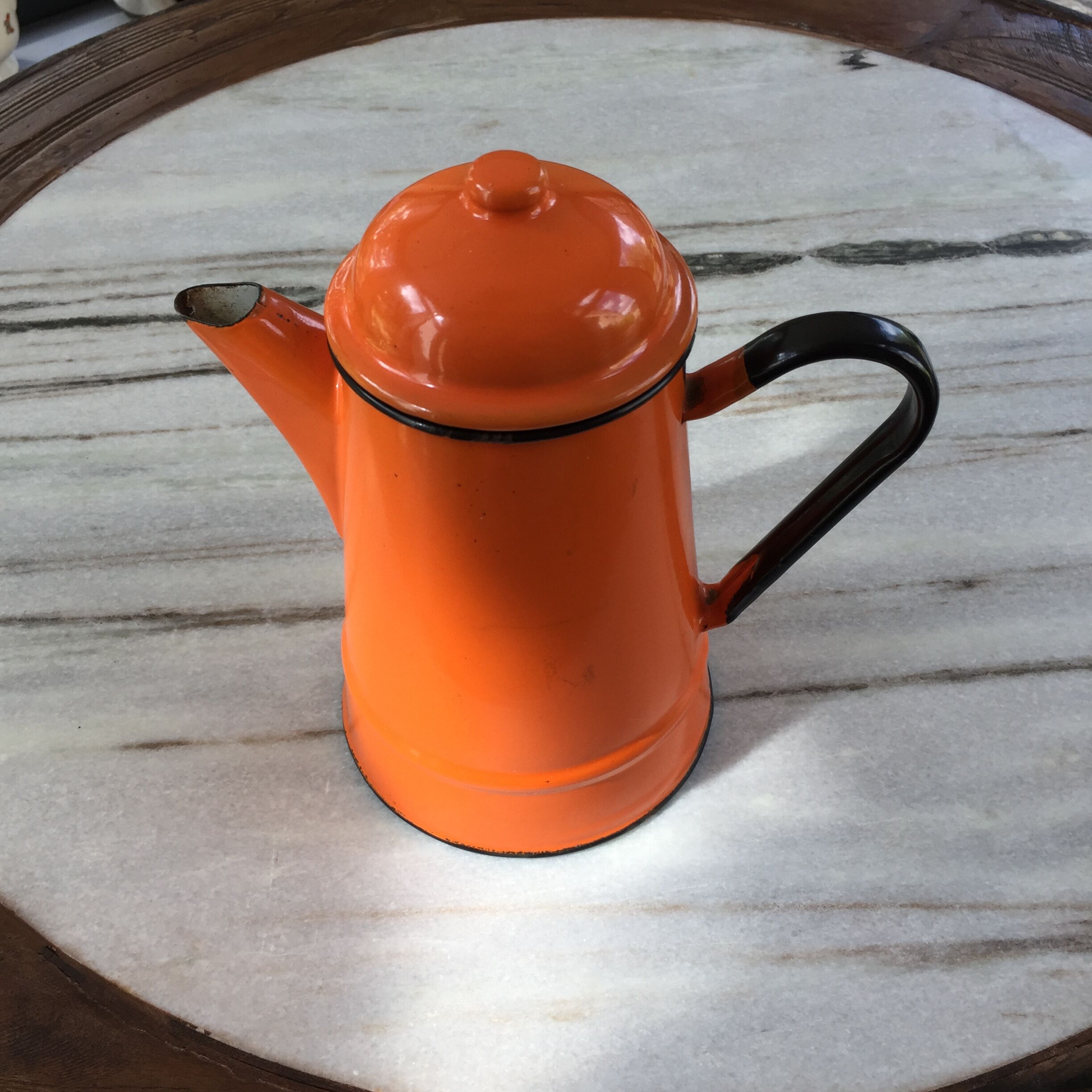 Orange and black enamelled sheet metal coffee maker