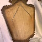 Miroir en bois doré décoré