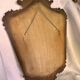 Miroir en bois doré décoré
