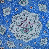 Decorative plate in blue enameled metal with bird motifs