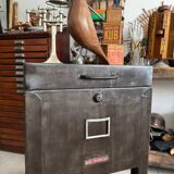 Old vintage industrial filing cabinet on wheels
