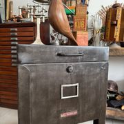 Vintage industrial filing cabinet on wheels