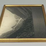 Photo in black and white mountain lake in golden frame