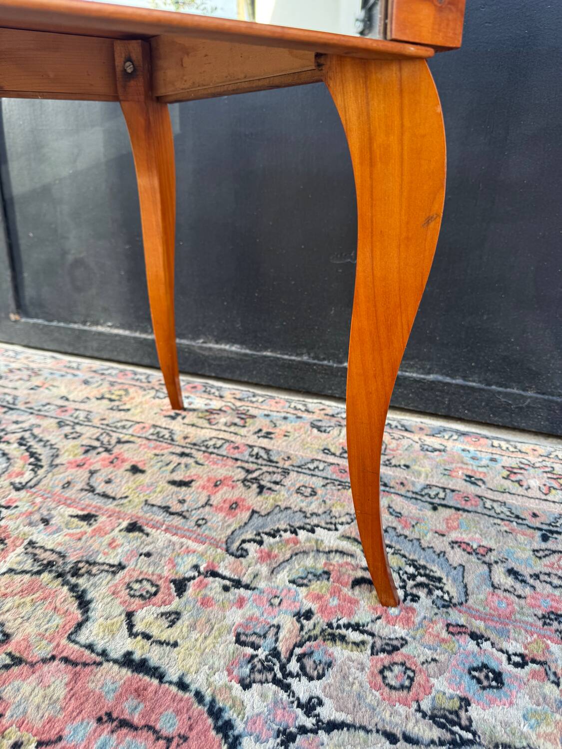 Small wooden coffee table with a mirror from the 1950s.