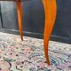 Small wooden coffee table with a mirror from the 1950s.