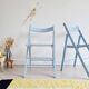 Blue folding chairs in lacquered wood