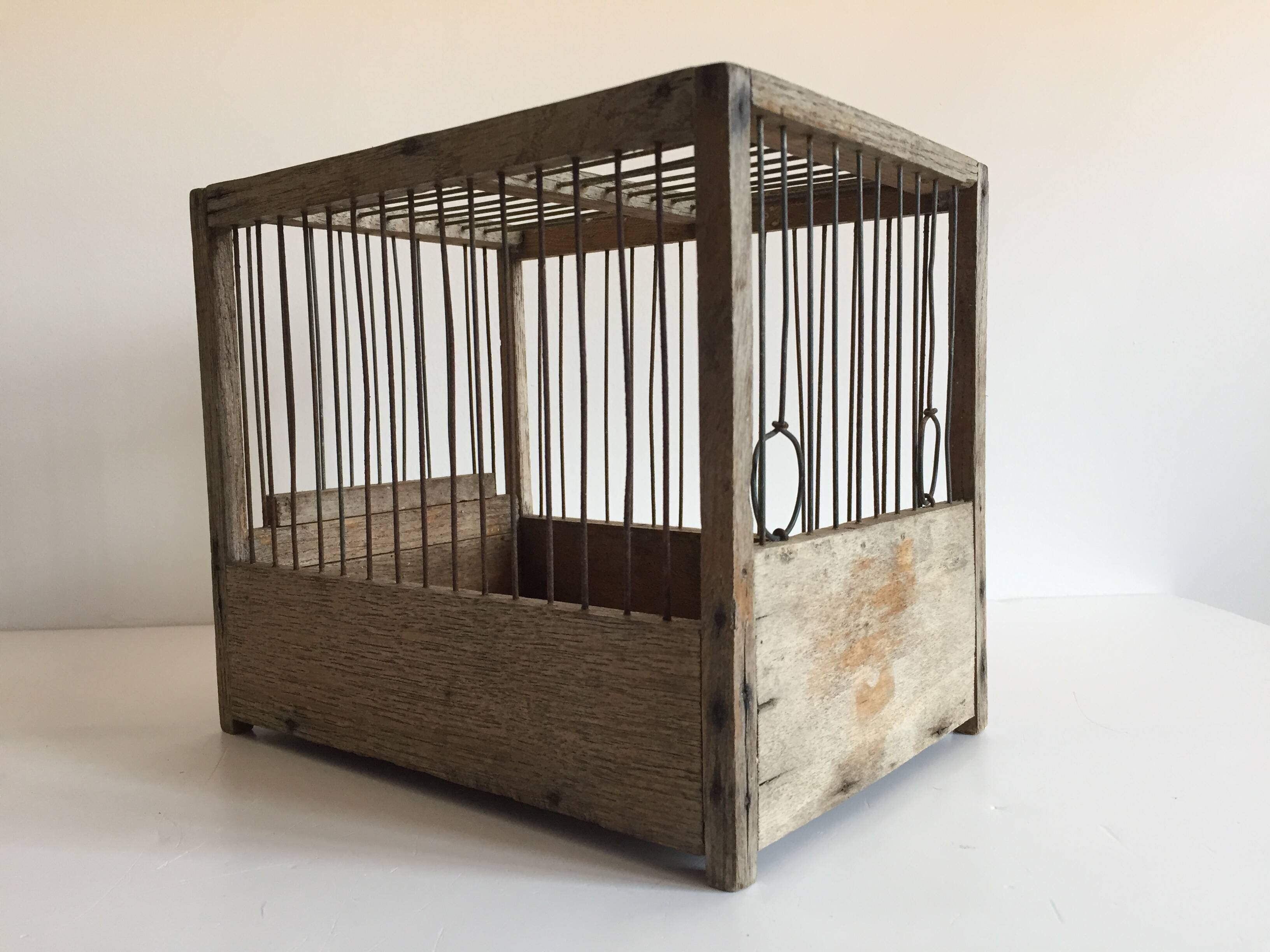 Old bird cage in wood and steel