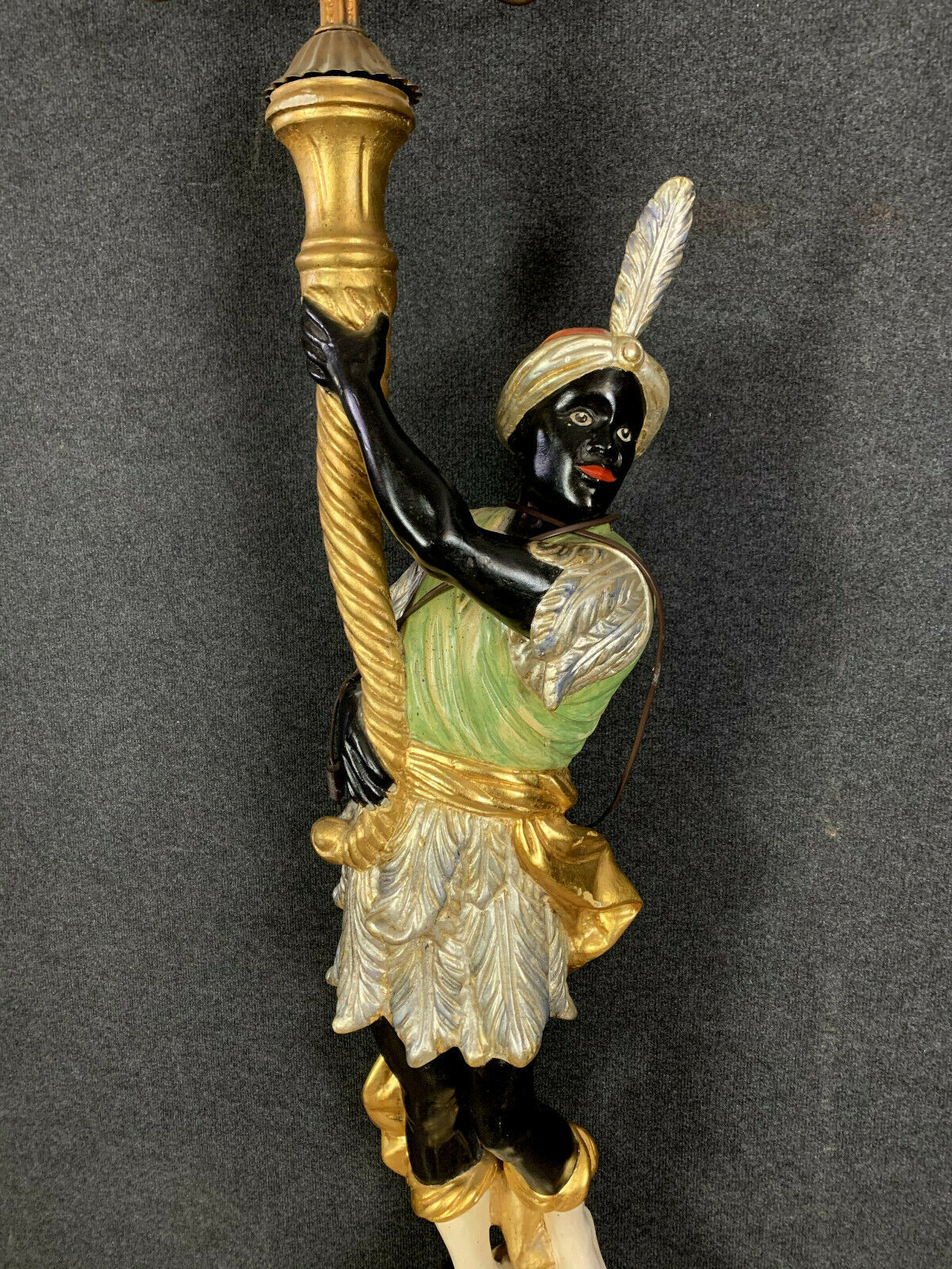 Early XXth era polychrome wooden torch has figuration of a Moor in traditional costume from the 18th