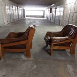 Armchairs in leather and vintage wood 70's