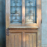 Oak entrance door at double chassis opening