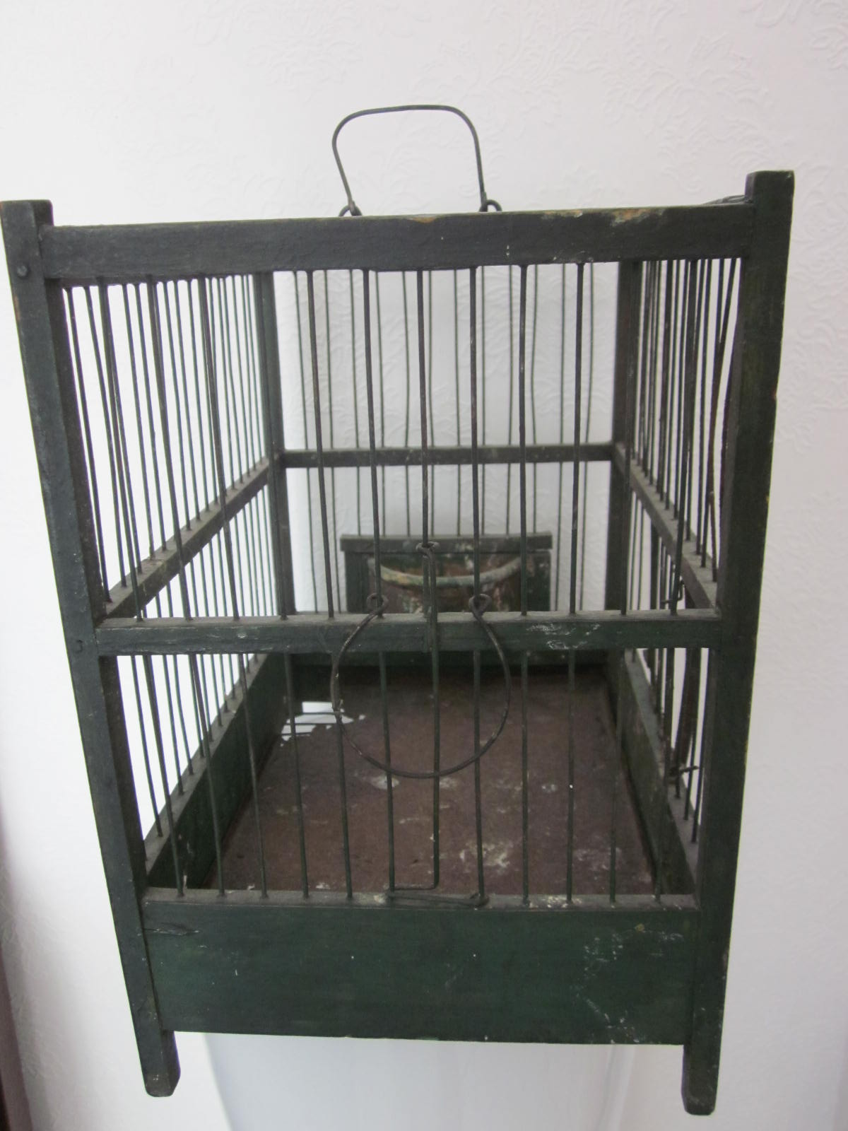 Wooden bird cage with feeder