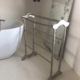 Old bathroom towel rack in patinated wood