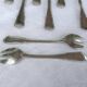 12 silver-plated oyster/dessert forks, filet pattern with contours.