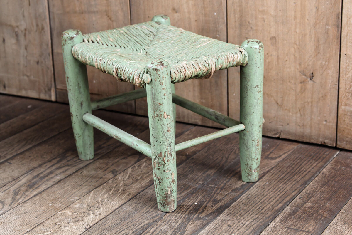 Old wooden and straw stool