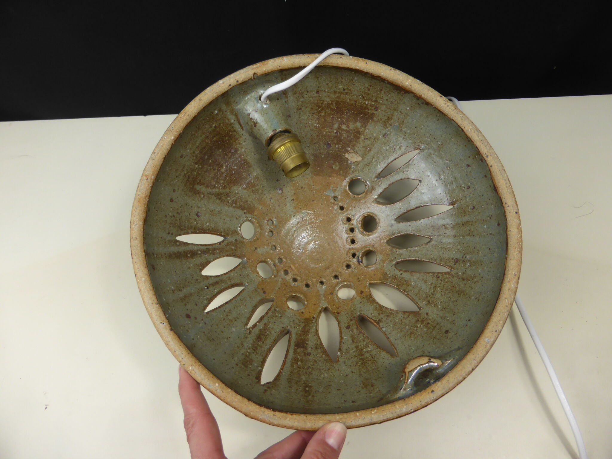 Wall lamp in openwork-vintage round sandstone shape