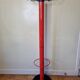 Coat rack in orange lacquered metal published by Seccose, 80s