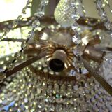 Antique castle style chandelier with tassels and floral details
