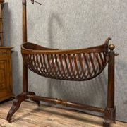 Empire style mahogany cradle with a swan neck, shaped like a cradle, circa 1810
