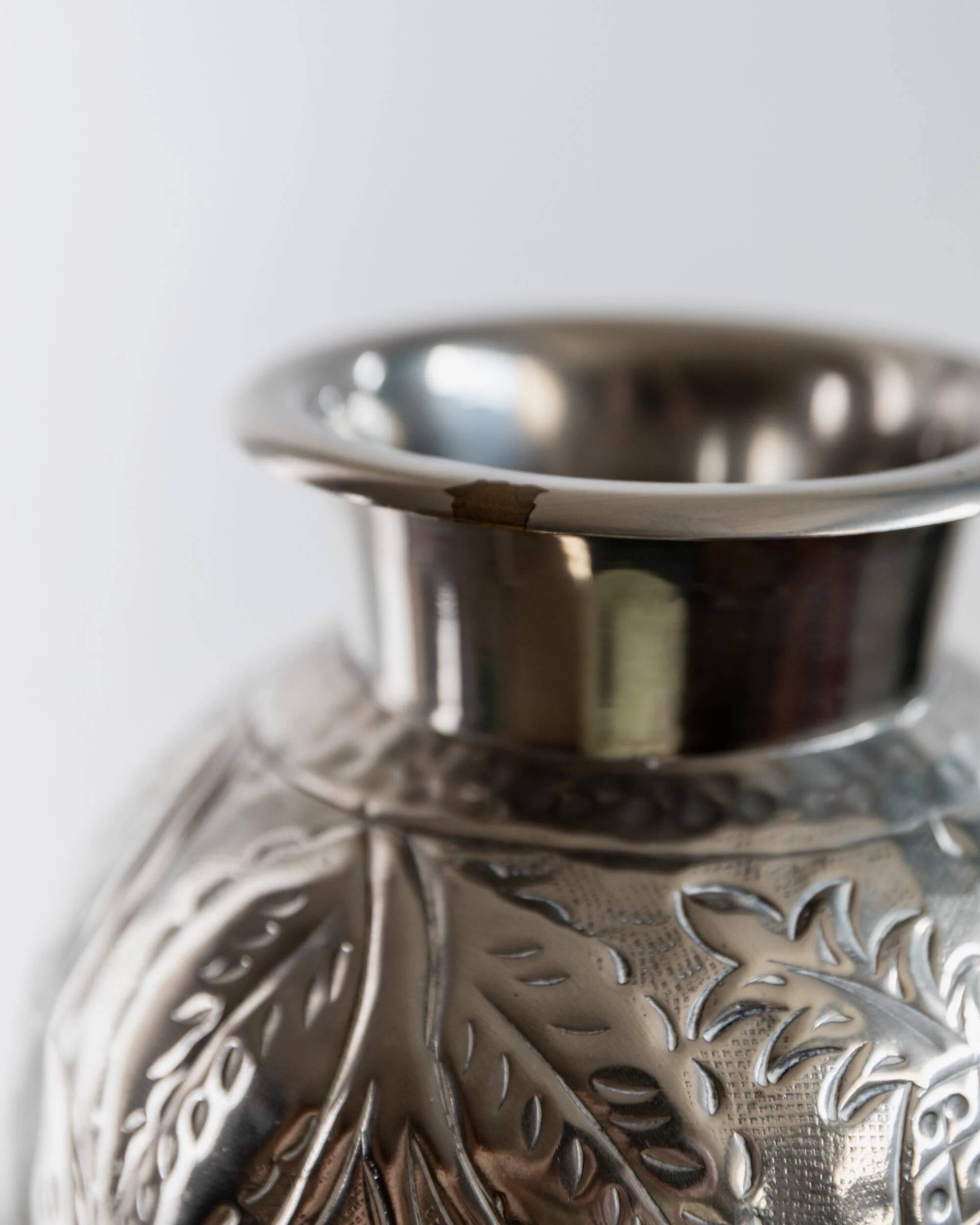 Vintage Italian vase in nickel-plated brass from the 1960s, hand-hammered relief of fruits and leaves.
