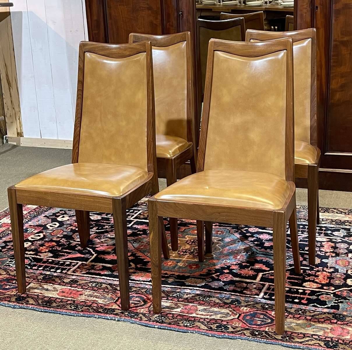 Set of 4 G-Plan chairs in teak and faux leather from the 1970s.