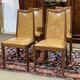 Set of 4 G-Plan chairs in teak and faux leather from the 1970s.