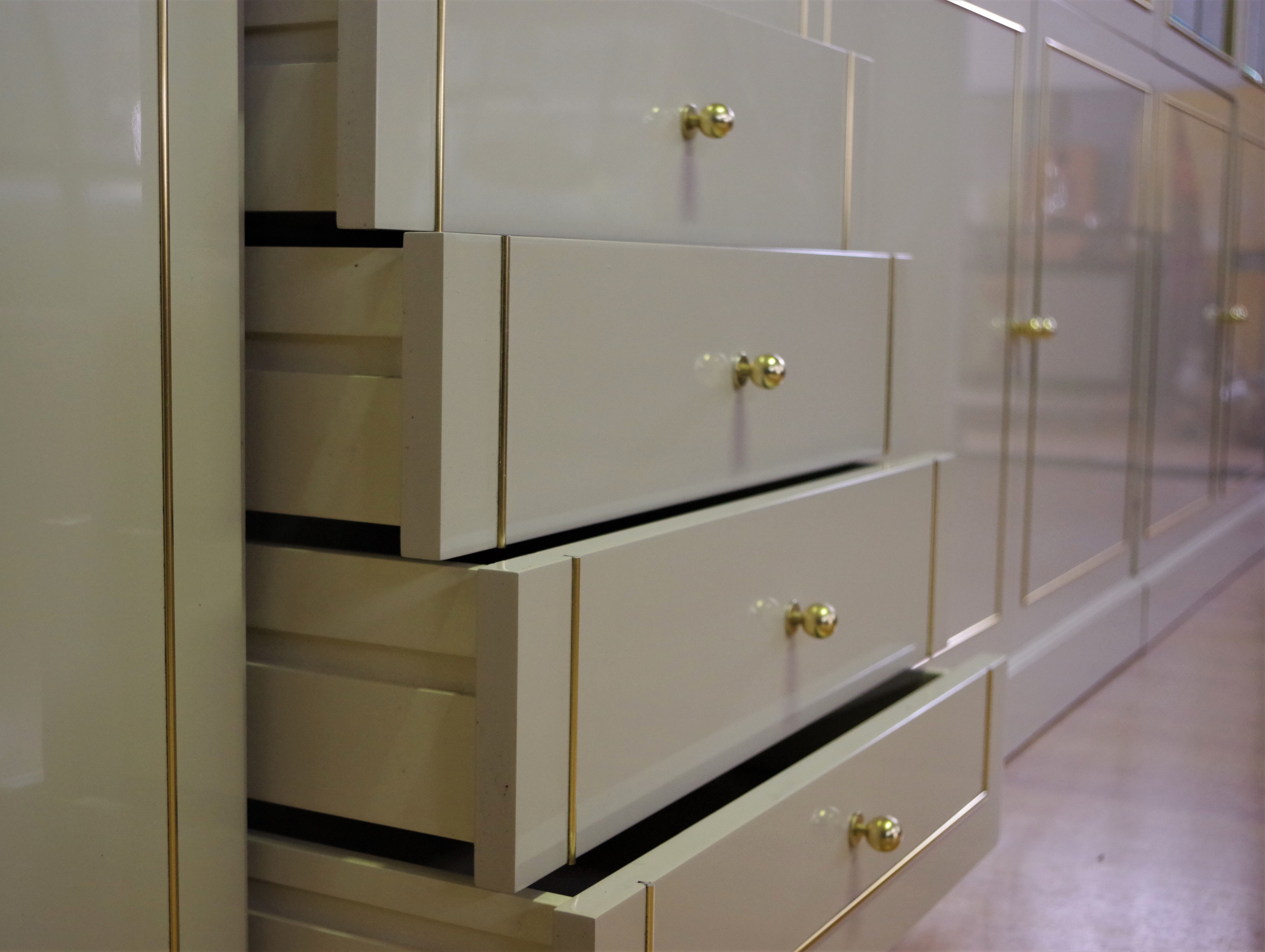 Showcases in lacquered wood, glass and brass  1970s, set of 4