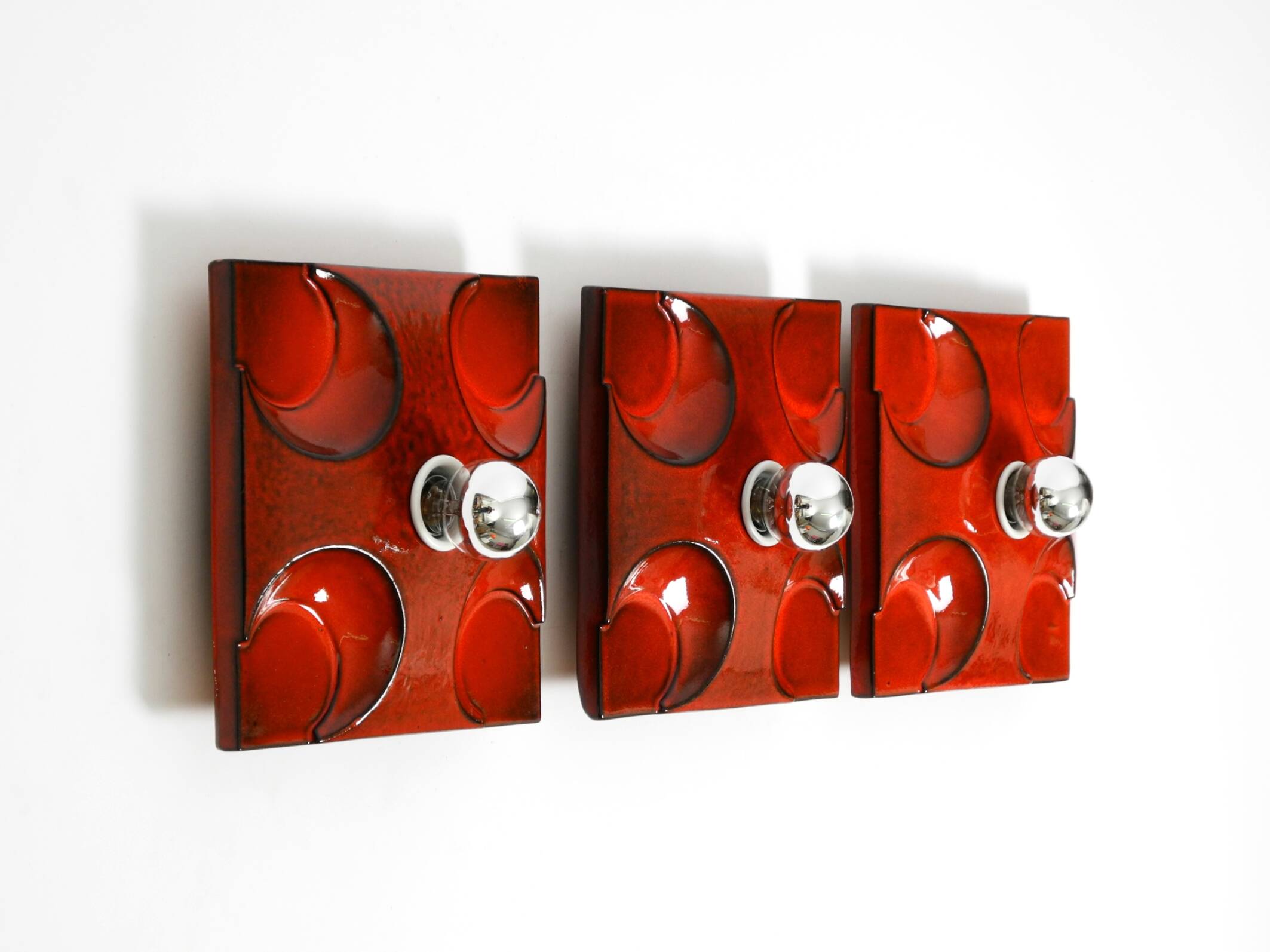 Three beautiful original 1970s Space Age red ceramic wall lamps