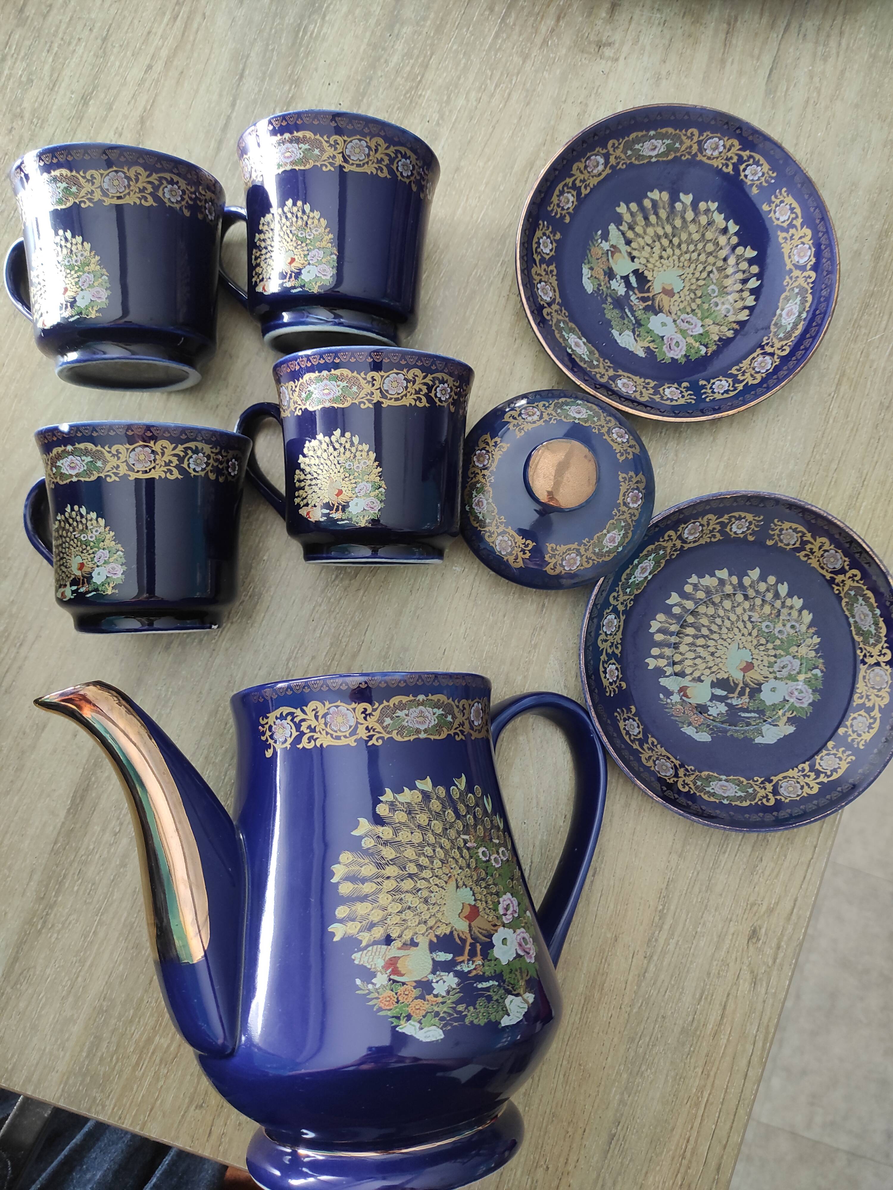 Vintage blue Taous dinnerware set of 21 pieces in very good overall condition.